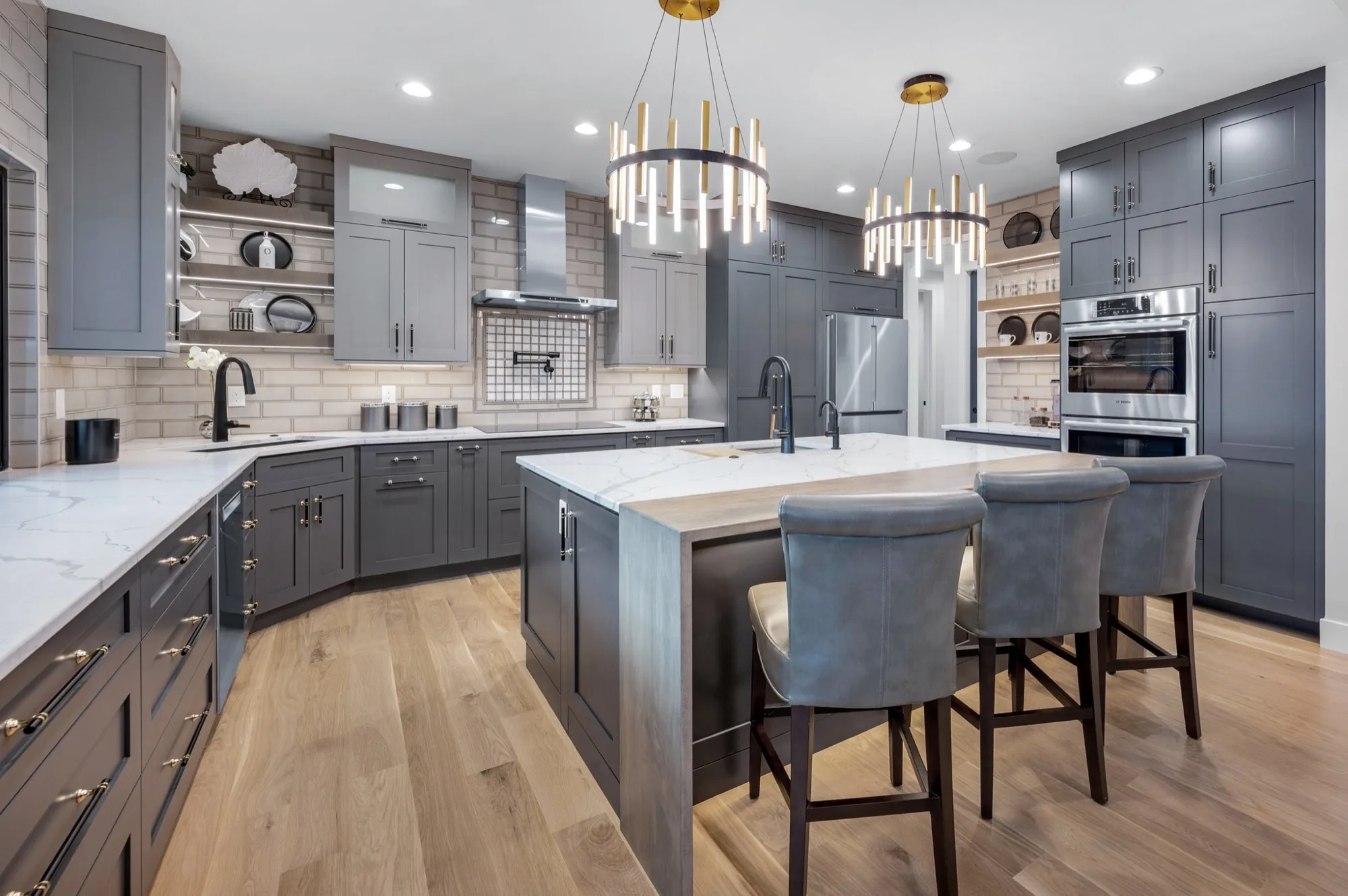 A custom kitchen built by Brooks Brothers Cabinetry, with a large island and painted cabinetry
