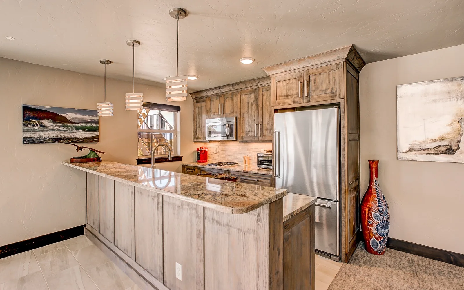 A knotty alder kitchen with a granite peninsula